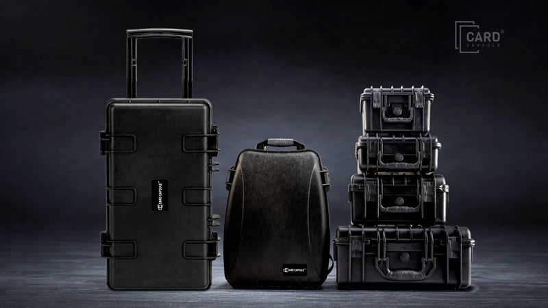 Card Capsule case lineup: the Trek roller case, Slabpack backpack, and a stack of four hard slab cases