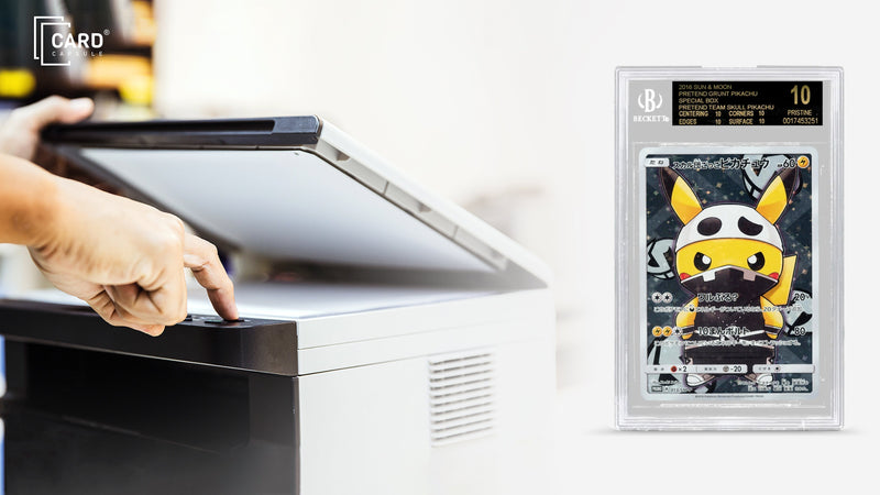 Hand opening a flatbed scanner lid beside a BGS-graded Pokémon card slab