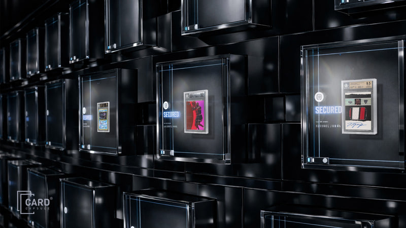 Graded card slabs stored in individual illuminated vault compartments marked secured