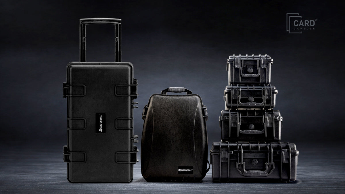 Card Capsule case lineup: the Trek roller case, Slabpack backpack, and a stack of four hard slab cases