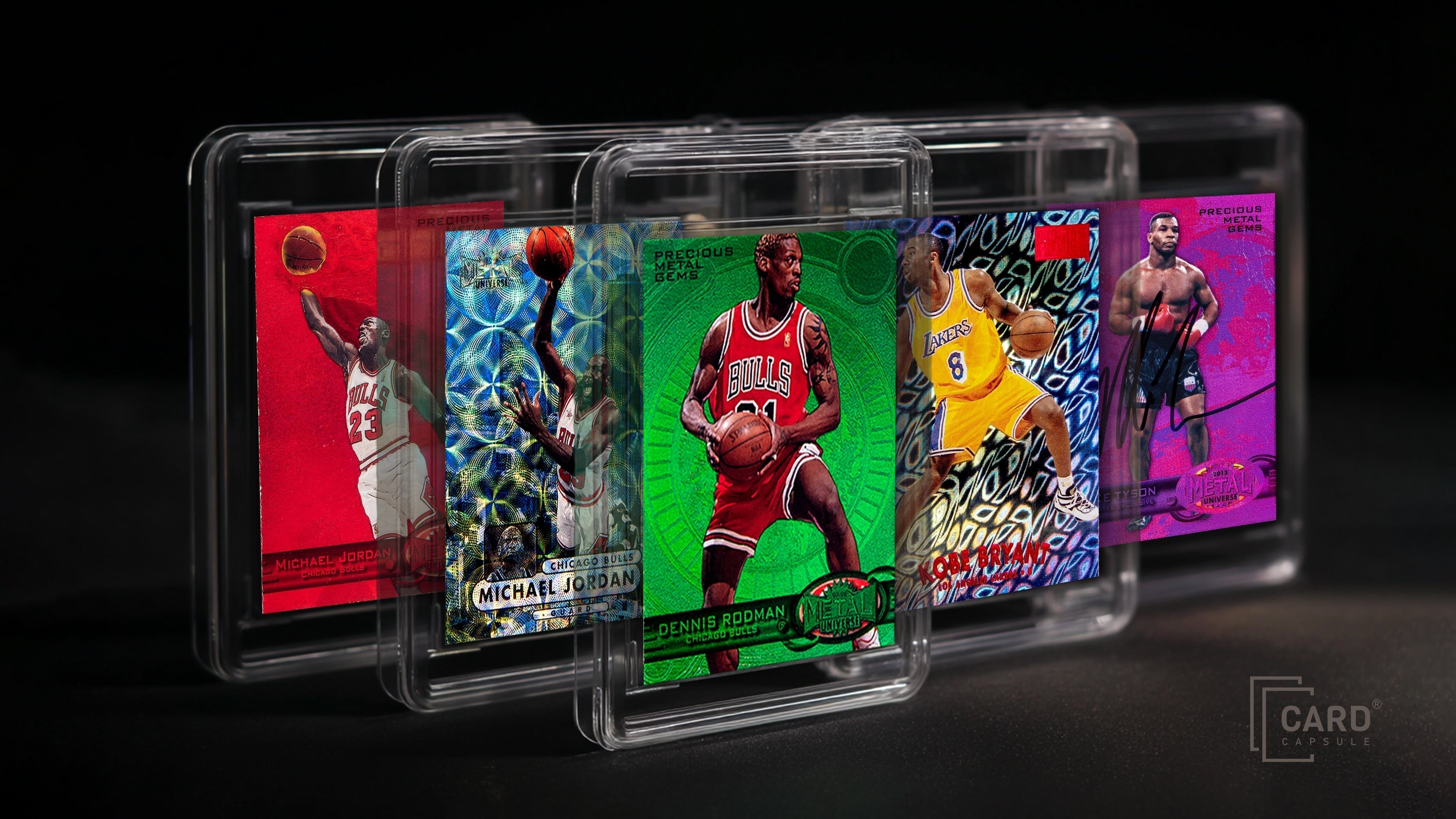 Five sports cards in clear magnetic one-touch holders, fanned out on a dark background