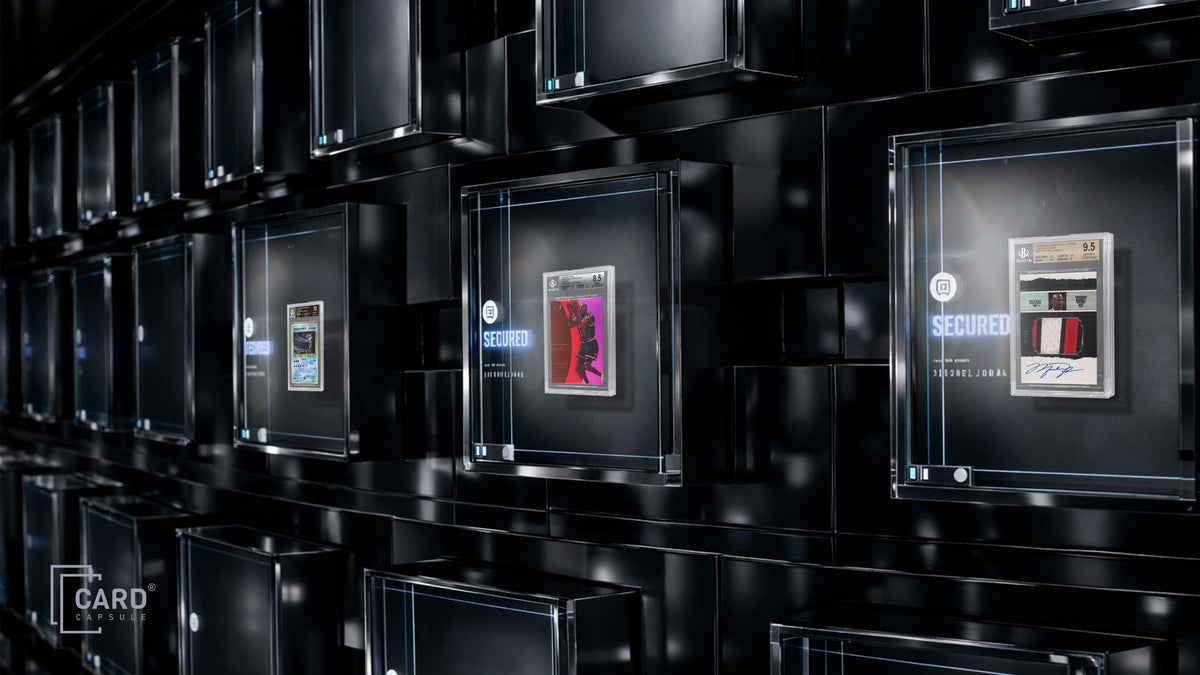 Graded card slabs stored in individual illuminated vault compartments marked secured