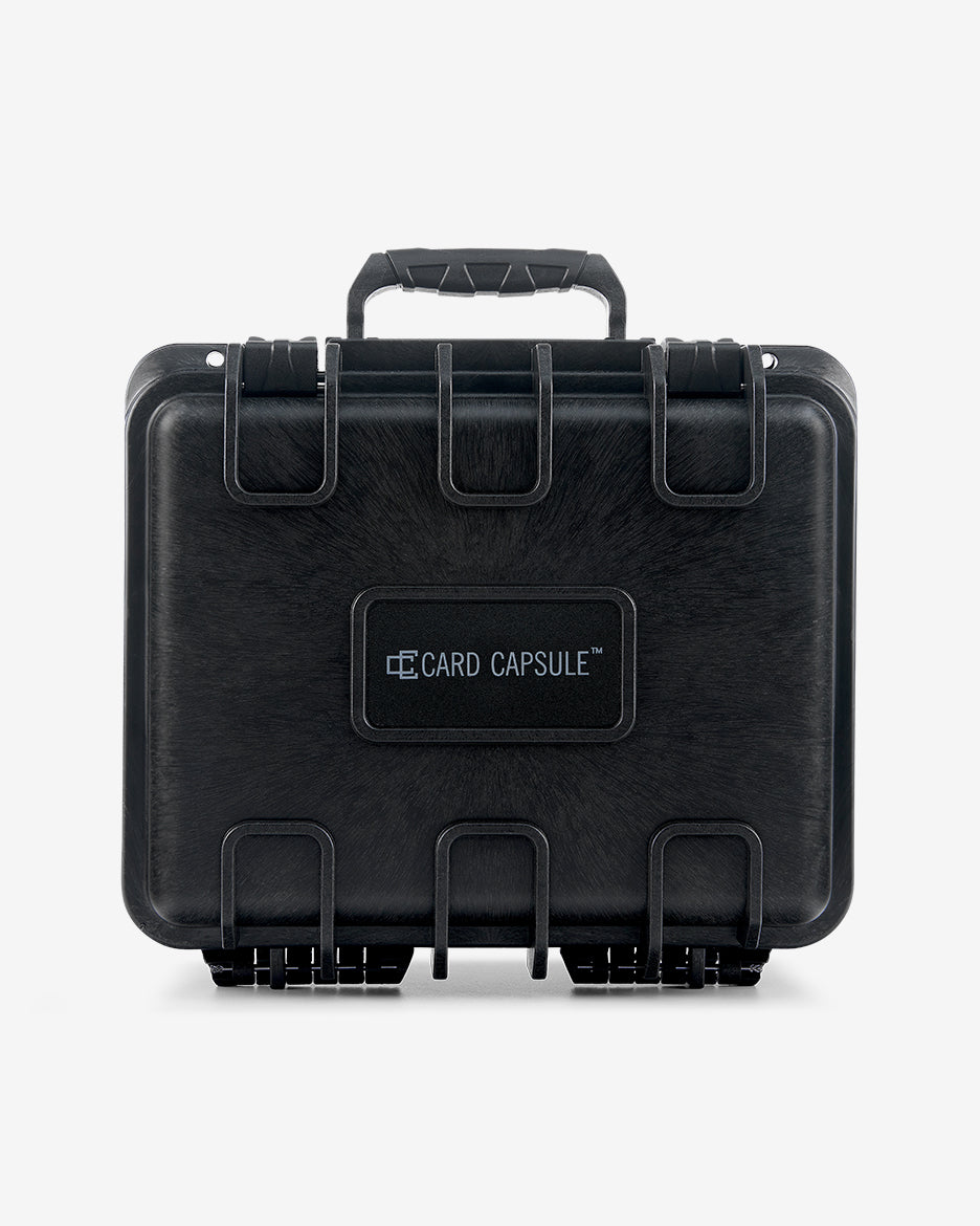 Closed Card Capsule Lite viewed straight on, showing the ribbed shell and logo panel
