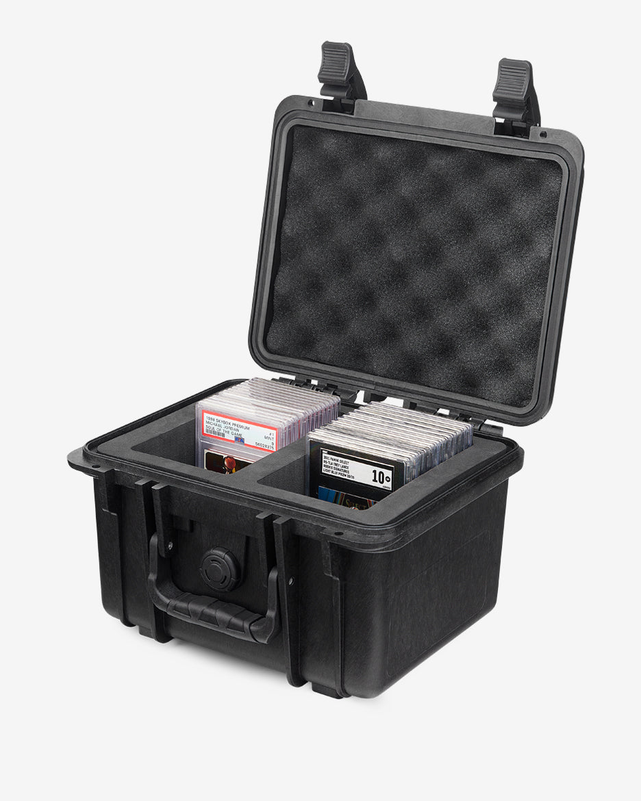 Card Capsule Lite open at an angle, loaded with graded slabs in both foam compartments