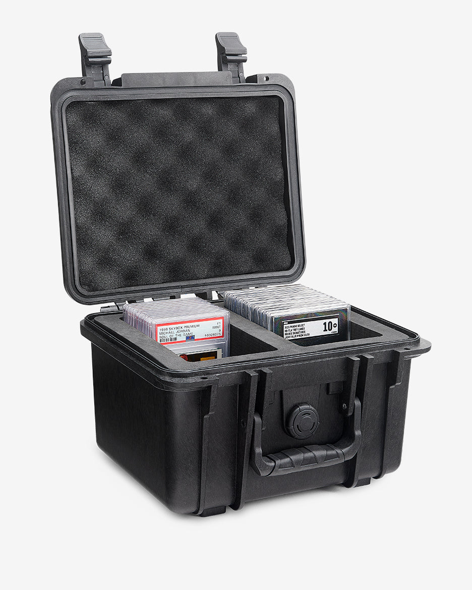 Card Capsule Lite open from the side, showing graded slabs seated in the divided foam tray