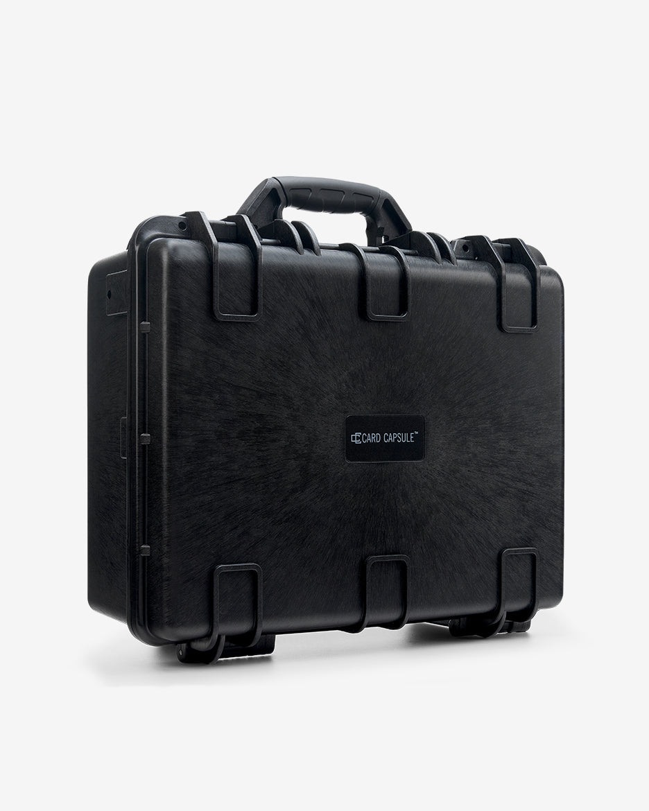 Closed Card Capsule Pro angled left, showing the carry handle and dual latches
