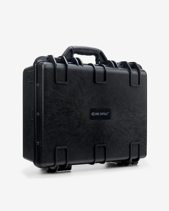 Closed Card Capsule Pro angled left, showing the carry handle and dual latches