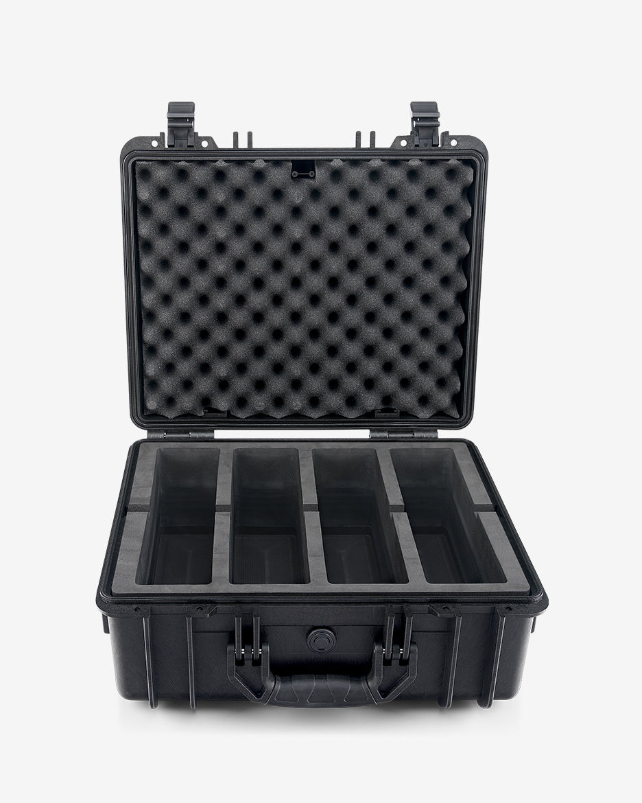 Card Capsule Pro open and empty, showing the four-compartment EVA foam tray and foam-lined lid