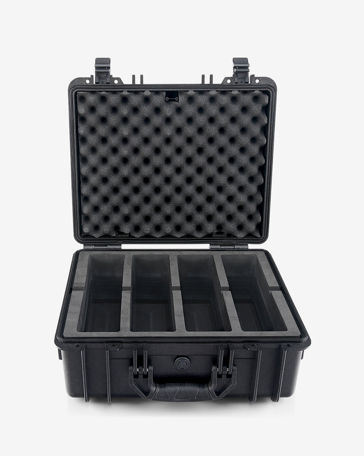 Card Capsule Pro open and empty, showing the four-compartment EVA foam tray and foam-lined lid
