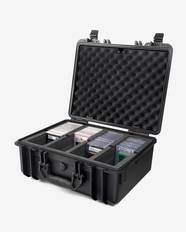 Card Capsule Pro open at an angle, loaded with graded slabs across four foam compartments