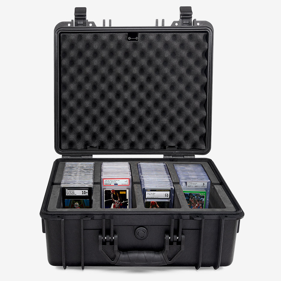 Card Capsule Pro open, four compartments loaded with graded slabs under a convoluted foam lid