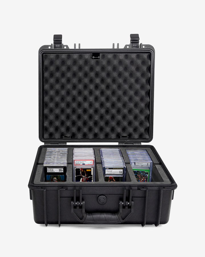 Card Capsule Pro open, four compartments loaded with graded slabs under a convoluted foam lid