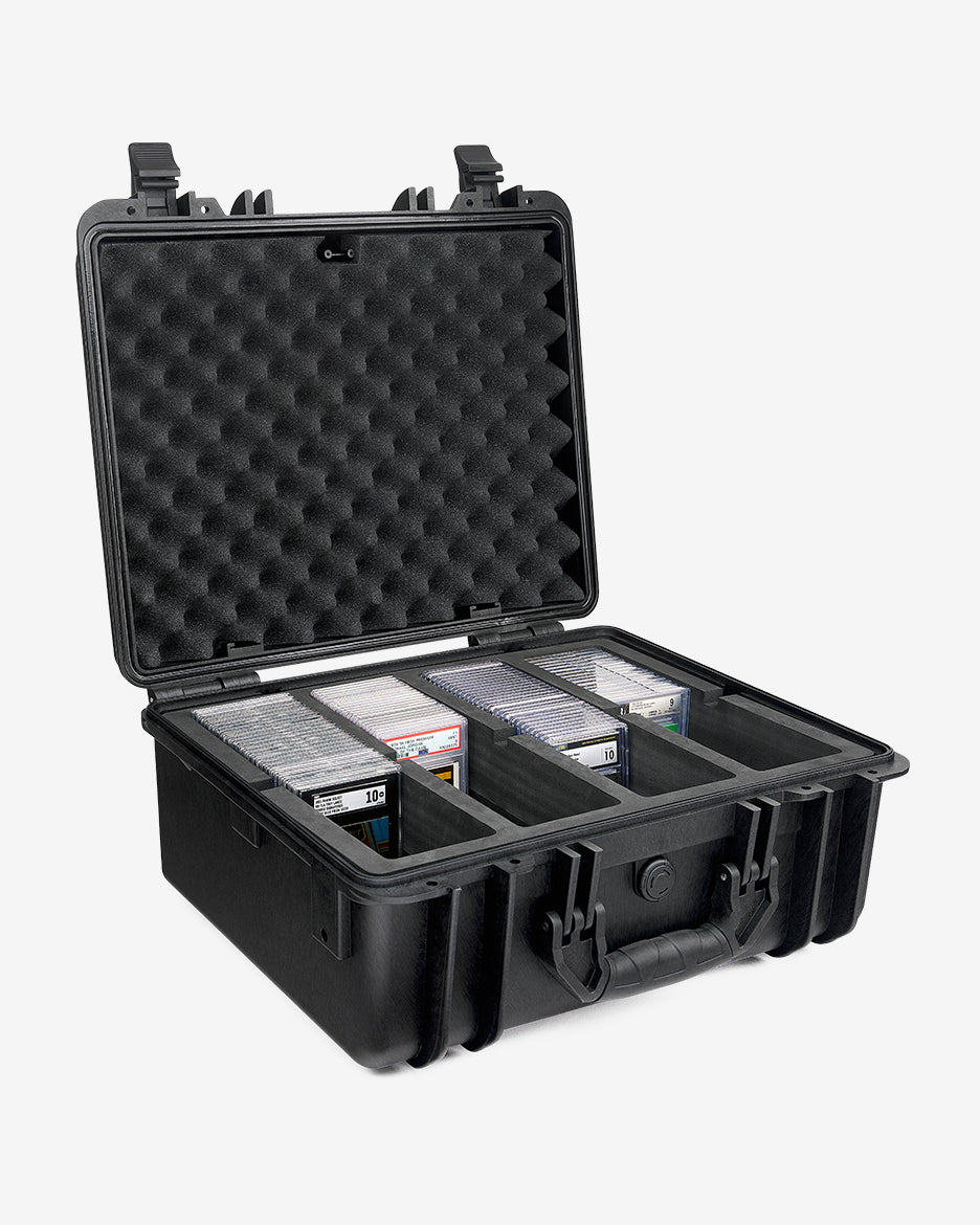 Card Capsule Pro open from the side, showing graded slabs seated in the divided tray