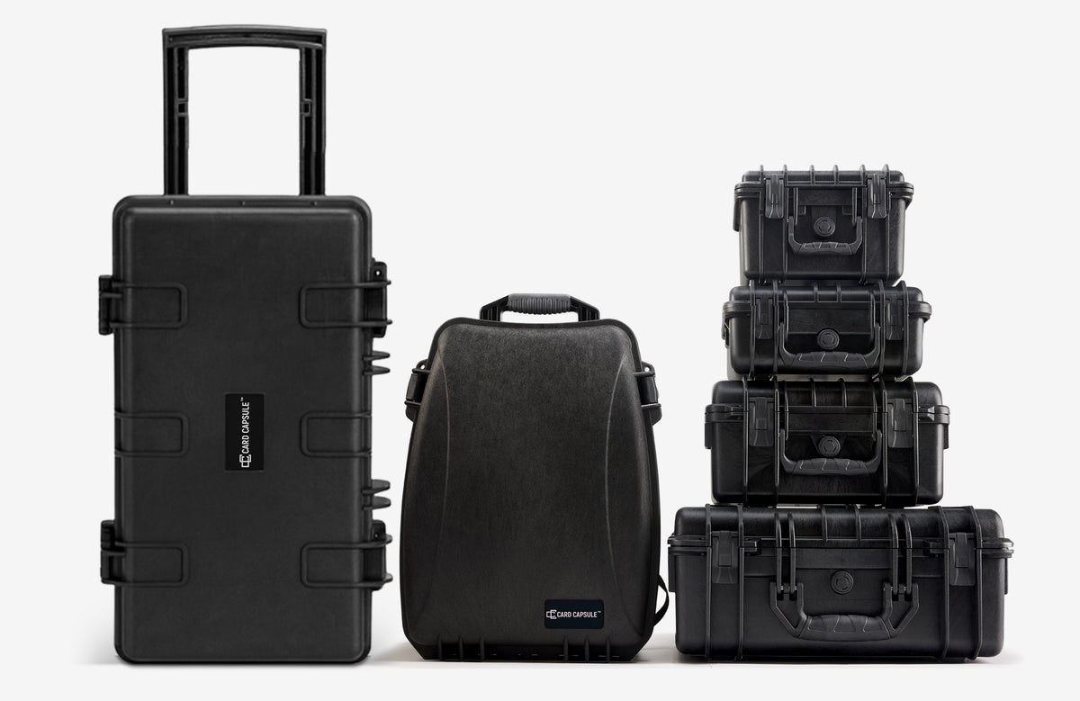 Card Capsule slab case lineup: the Trek roller case, Slabpack backpack, and stacked hard cases