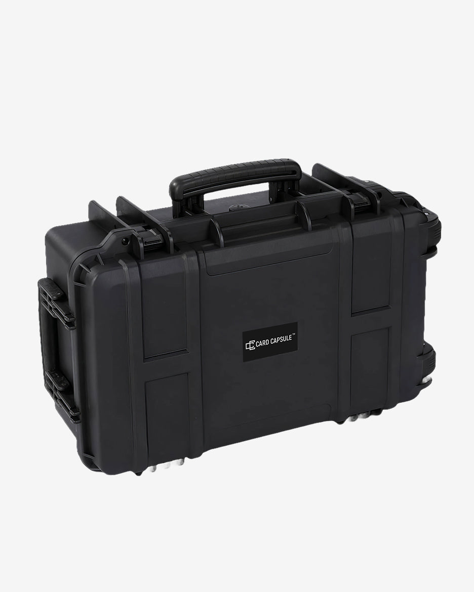 Closed Card Capsule Trek from the side, showing the carry handle, wheels, and reinforced ribbing