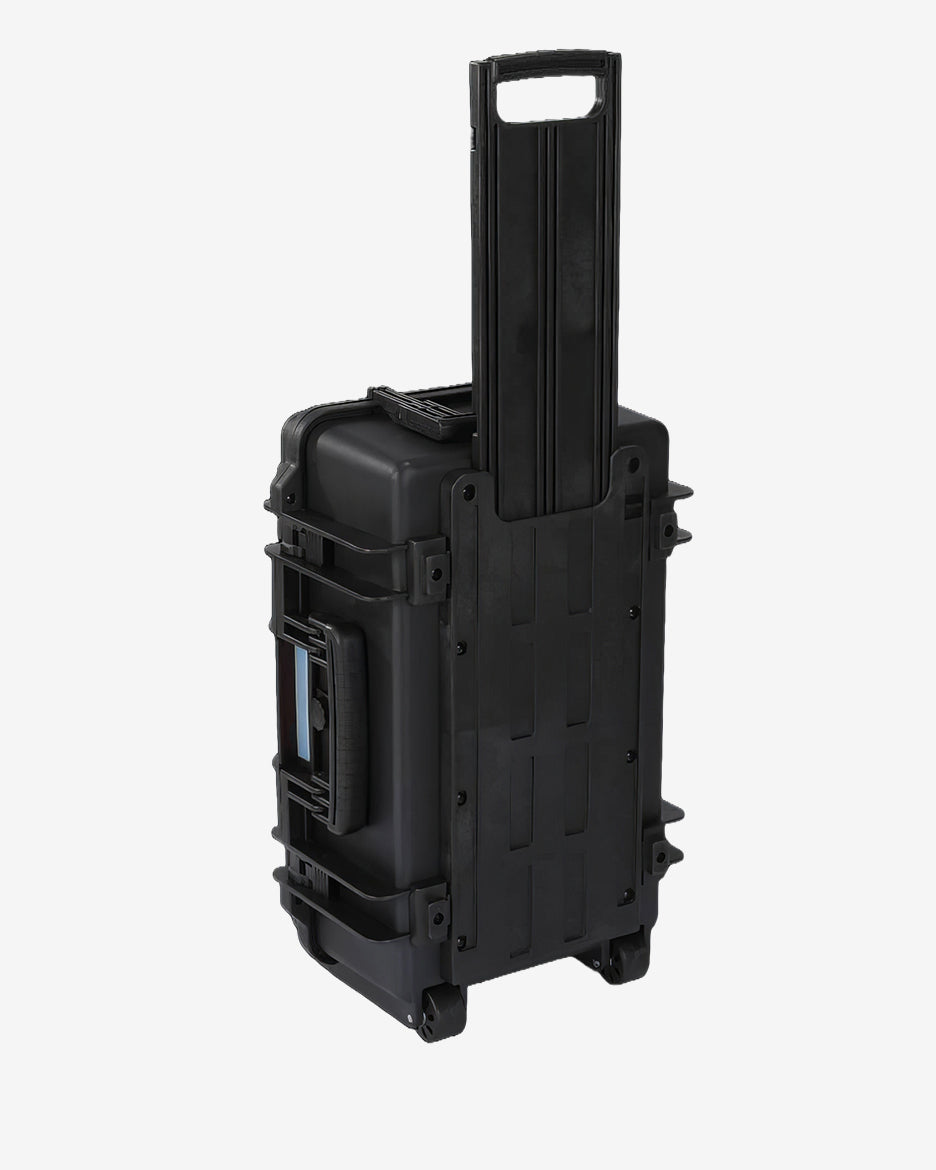 Card Capsule Trek standing upright with the telescoping handle extended for rolling