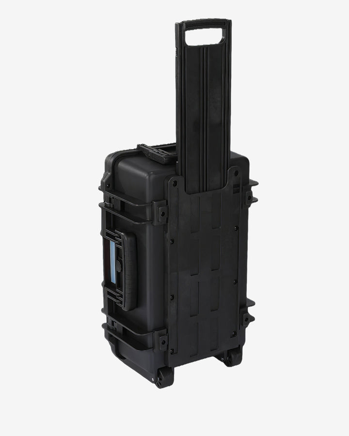 Card Capsule Trek standing upright with the telescoping handle extended for rolling