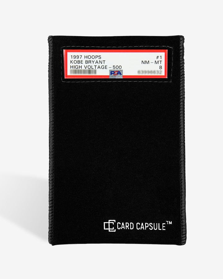 PSA slab inside a black velvet Card Capsule bag, with the grade label showing through the window